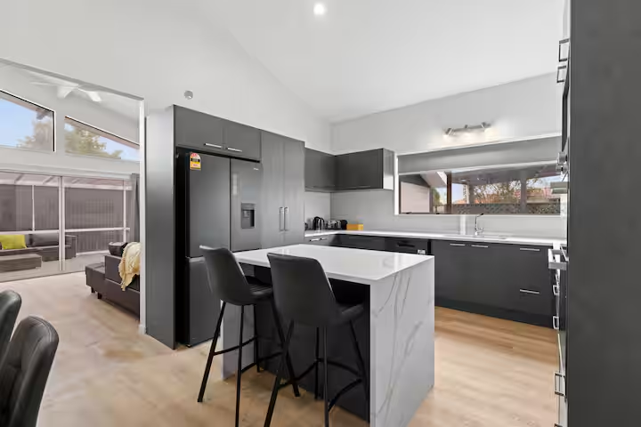 BROOKSIDE RESIDENCE open-plan living lounge with 85-inch Smart TV